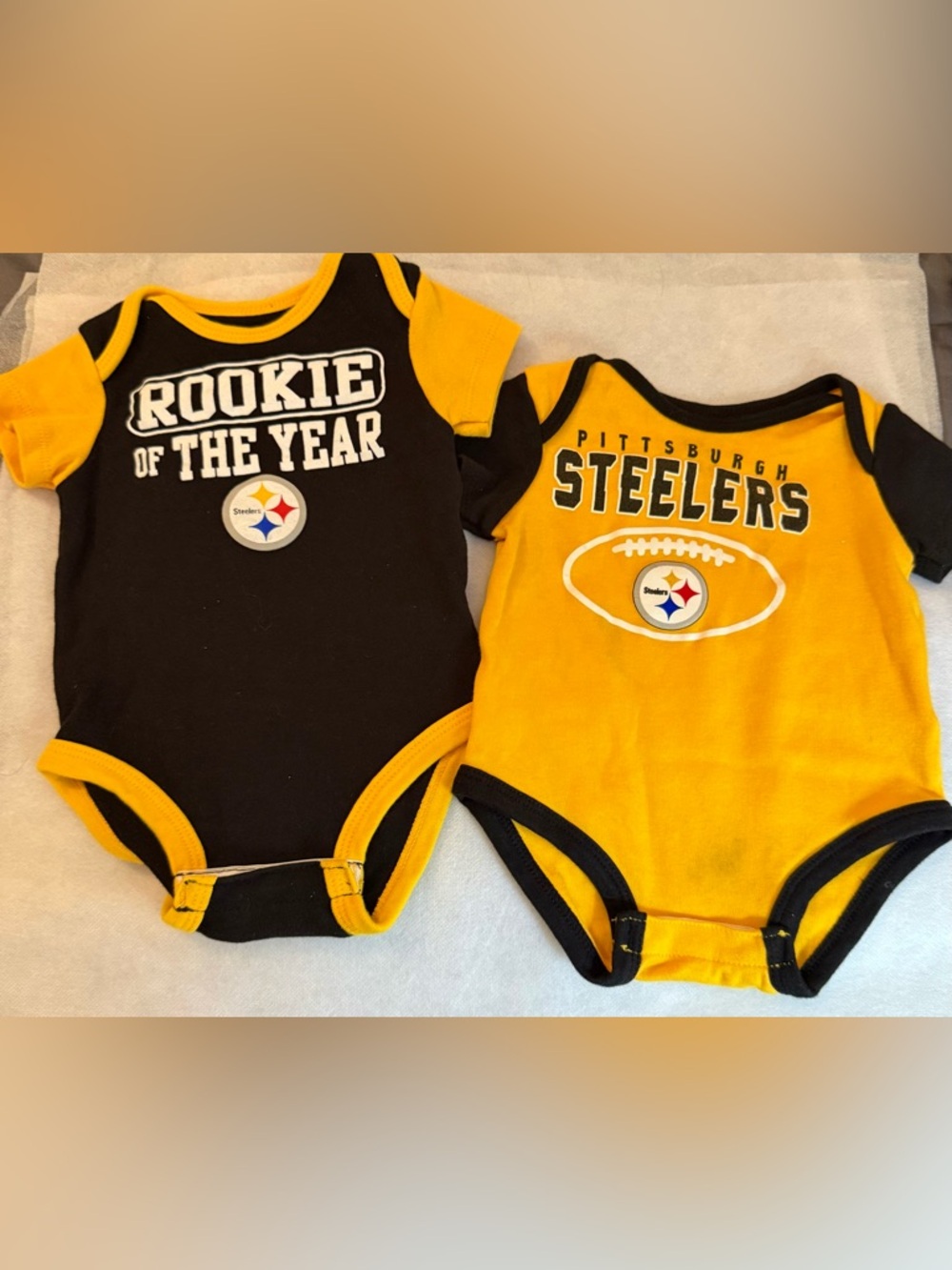 2 NFL Pittsburgh Steelers onsies. 3/6 Mos.